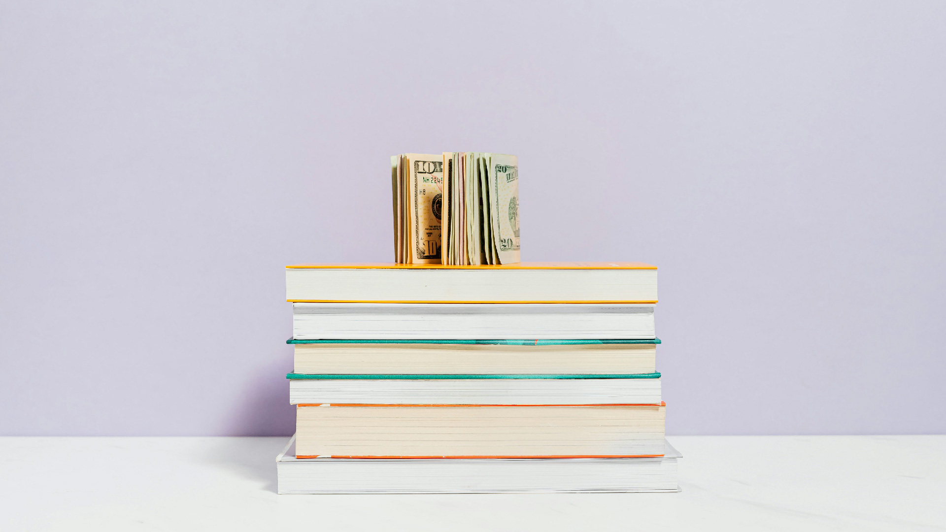 Money on Book Stack